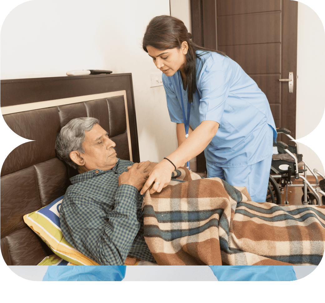 Trained caregiver assisting senior citizen at home in Bangalore